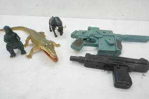 lot 89 image: Vintage plastic toys, dinosaurs and toy plastic guns