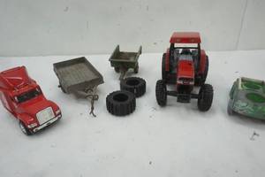 lot 94 image: Kid Toys, Case Cast Iron Tractor, John Deere Trailer, Semi Bobcat (no Trailer)