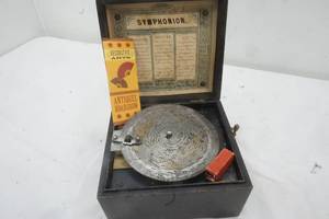 lot 128 image: Antique Symphonion Box with Music Plates ( Appraised by Antiques Roadshow)