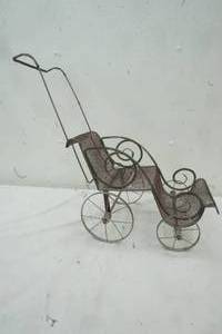 lot 177 image: Vintage metal doll buggy