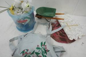 lot 338 image: Craft Flowers, apron, small green wheel barrel, and more