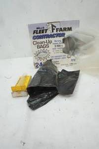 lot 467 image: Used Fleet Farm Contractor Clean Up Bags, and a couple black garbage bags
