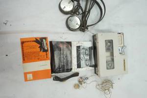 lot 483 image: Vintage Head Phones and a Vintage Lloyds Tape Recorder with ear piece and Microphone