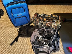 lot 58 image: Blue Cloth Rolling Suitcase and Two Duffle Bags