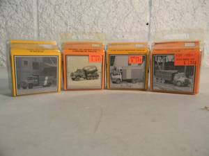 lot 11 image: 4 MAGNUSON MODELS N SCALE - MODEL U HEAVY DUTY CONCRETE TRUCK 439-801 - CAB OVER REEFER TRUCK 439-803 - HEAVY DUTY COAL TRUCK 439-804 - LINE TRUCK 439-806 - IN BOX - GREAT PIECES - SEE PICTURES