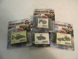lot 14 image: 4 GHQ ROAD MASTERS N SCALE FORD-VERSATILE 846 FARM TRACTOR 54-0003 - 120 ROAD GRADER 53-0005 - JD 310 A TRACTORLOADERBACKHOE 53-0006 - IH FARMALL SUPER M-TA 54-0005 - IN PACKAGE - GREAT PIECES - SEE PICTURES