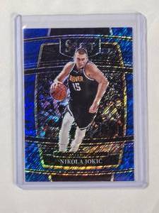 lot 20 image: Nikola Jokic 2021-22 Panini Select Blue Shimmer Prizm No. 82