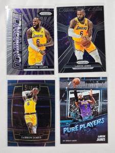 lot 39 image: Lot of 4 Lebron James 2021-22 Panini Select No.100, 2023-24 Panini Prizm No. 7, 2023-24 Panini Prizm Dominance No. 3 & 2023-24 Panini Hoops Pure Players No. 4