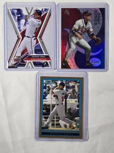 lot 139 image: Lot of 3 Chipper Jones 2009 Bowman Gold No. BDPW31, 2008 Upper Deck Die Cut No. 7, 2000 Fleer eX No. 10