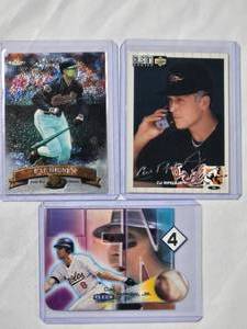 lot 149 image: Lot of 3 Cal Ripken Jr. 1993 Upper Deck Silver Auto No. 240, Fleer 2000 Inferno Die Cut No. 9 of 10, 1998 Topps Finest No. 135