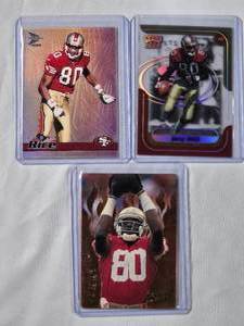 lot 266 image: Lot of 3 Jerry Rice - 1994 Action Packed Catching Fire No. FB944, 1999 Pacific Prism No. 128, 1999 Playoff Momentum No. 138