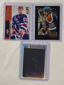 lot 287 image: Lot of 3 Wayne Gretzky Cards - 1990 Upper Deck Superstars Holo, 1996 Collectors Edge Winning Formula No. 290, 1995 Upper Deck Wayne Gretzkys Record Collection No. G12