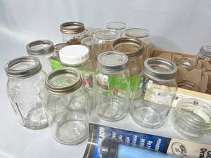 lot 28 image: Various Sizes of Canning Jars (some with lids), Misc. Lids and Suction Plunger