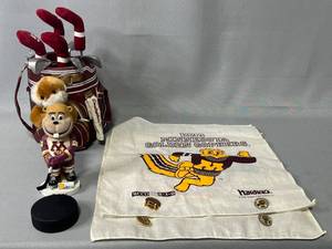 lot 41 image: Caddyshack Musical Golf Bag (working condition), Goldy Gopher Bobble Head, Official Hockey Puck, 1993 MN Golden Gopher Hankies w Pins