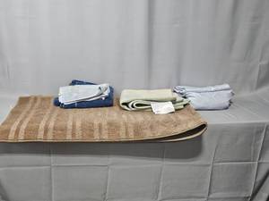 lot 63 image: Light Brown Hall Runner, Twin Sheet Set (light lavender), Rug, Various Towels