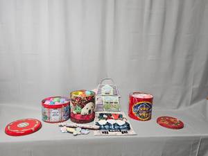 lot 65 image: Three Holiday Tins Filled w Plastic Easter Eggs & Misc Easter Decor