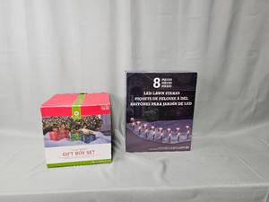 lot 97 image: LED Candy Cane Lawn Stakes & Lighted Gift Boxes