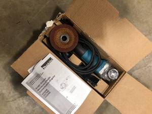 lot 31 image: 7.5 Amp Corded 4-12 in. Easy Wheel Change Compact Angle Grinder with Grinding Wheel, Wheel Guard and Side Handle   Customer Returns See Pictures