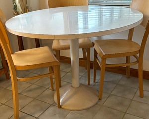 lot 24 image: Round Pedestal Style Kitchen Table and Four Design within Reach Chairs
