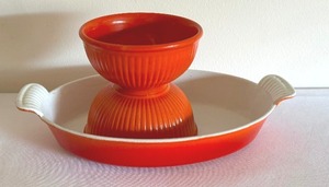 lot 334 image: Two Vintage Small Orange Bowls and Enamel Cast Iron Baking Dish