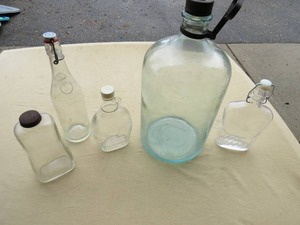 lot 59 image: Vintage Glass Bottles  Oil Burner