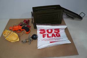lot 62 image: Metal Ammo Box with Flare Gun and SOS Flag