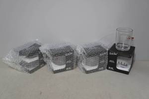 lot 94 image: 4 Lucky Shot Rocks Glasses with Embedded Bullets