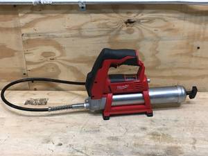 lot 65 image: Used Milwaukee M12 12V Lithium-Ion Cordless Grease Gun Model # 2446-20 (Tool-Only)