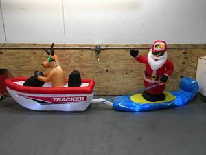 lot 104 image: Used Bass Pro Shops Inflatable Wakeboarding Santa 4.5 Ft H x 14 Ft W