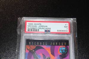 lot 20 image: 1995-96 Hoops Number Crunchers Michael Jordan #1 PSA 7