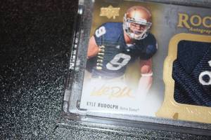lot 21 image: 2011 Exquisite Rookie Autograph Patch Kyle Rudolph #143 23135  Only 135 Exist