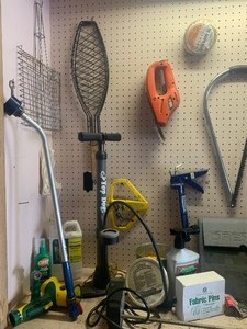lot 117 image: Tool Bench Items Including Yard Care Items, Tools, Sprinklers and Much More