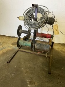 lot 130 image: Wire Spool Rack with Wire, Tire is Bad, Needs Tires
