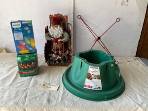 lot 309 image: Christmas items - lights, tree stand, Santa decanter