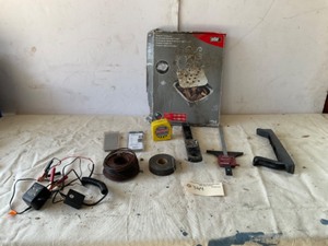 lot 344 image: Misc Iems - Weber smoking chips, Brad nails, Tape measure, receiver hitch, wire, battery maintainer, tote, curb finders