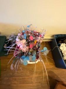 lot 483 image: Rubber bin and floral arrangement