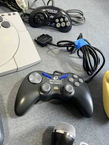 lot 26 image: Vintage Video Game Controllers - PlayStation ASCII Ware, Quickshot, PS2 Performance Impact, SEGA Dreamcast, Rock Band, and More