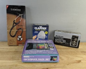 lot 103 image: Assorted Home and Office Items Reference Rack, The Clapper, Stethescope, and Sankyo Mini Tape Recorder E