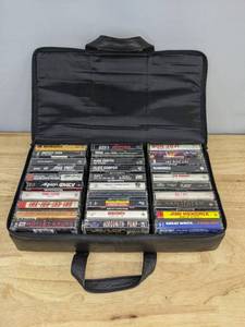 lot 64 image: Brookstone Cassette Tapes Carrying Case Includes Metallic, Motley Crue, Judas Priest, Anthrax, and More E