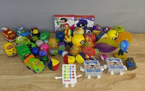 lot 125 image: Assortment of Kids Toys and McDonalds Happy Meal Toys Bakugans, Go Go Smart Wheels, Teen Titans Go, Mini Hasbro Games and More E