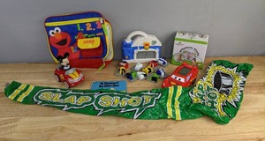 lot 102 image: Assorted Kids Toys Lightning McQueen Vtech Learn and Go, Elmo Lunch Box, LeapFrog Fridge Wash and Go Magnet Vehicle Set, and More E