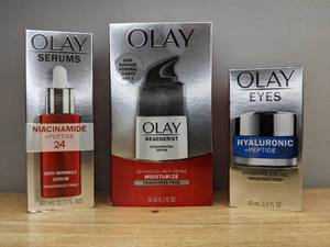 lot 39 image: Brand New Olay Beauty Products Hydrating Gel Eye Cream with Hyaluronic Acid, Age Defying Anti-Wrinkle 2-in-1 Day Cream, and Niacinamide  Peptide 24 Anti-Wrinkle Face Serum Retail $64.95 O