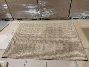 lot 168 image: 63x89 Tan Area Rug
