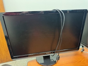 lot 22 image: Three Matching 24 Dell Monitors