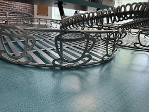 lot 57 image: Pair of Metal Serving Trays (Coffee Cup Design)