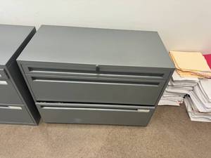 lot 132 image: Pair of Gray Three Drawer File Cabinets with keys.