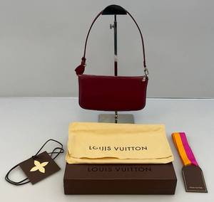 lot 1 image: EST  $800.00 - $1,100.00  Louis Vuitton Fuchsia Pink Epi Leather Small Shoulder Bag With Box, Dust Bag Tags & More (LIKE NEW) 1 34 x 5T x 9W