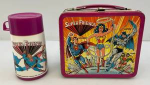 lot 51 image: 1976 SUPERFRIENDS Embossed Metal Lunch Box (With Thermos)