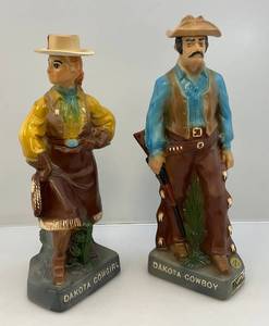 lot 56 image: 1975 EZRA BROOKS Dakota Cowboy & Dakota Cowgirl Decanters