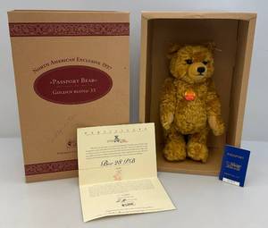 lot 67 image: 1997 North American Exclusive Limited Edition 19073,500 Growler PASSPORT BEAR Golden Blond 33 EIN 665318 With Certificate
